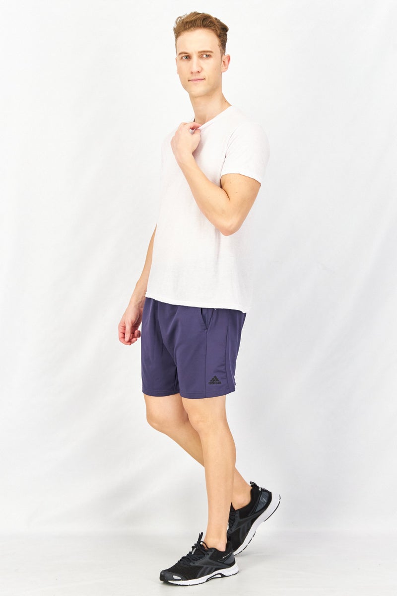 Adidas شورتات تدريب للرجال بلياقة 7 إنش بشعار العلامة التجارية، أزرق نيلي - Image 4